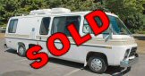 White GMC Motorhome with dark side windows, marked SOLD